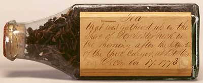 Tea leaves in glass bottle collected on the shore of Dorchester Neck the morning of 17 December 1773 Glass bottle containing tea