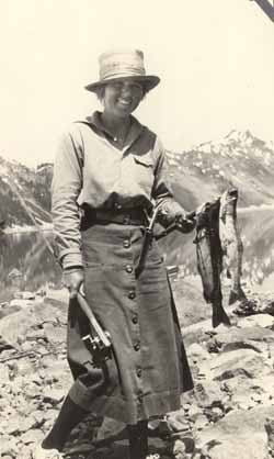 Eleanor `Nora` Saltonstall  in mountains holding fish Photograph