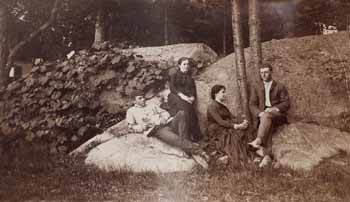 George C. Adams, Charles F. Adams, Mary O. Adams, and Mary Adams, at Beverly Farms, seated on rocks Photograph