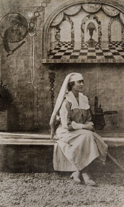 Mildred Mitchell sitting under a frescoed wall Photograph